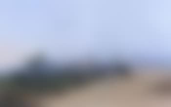 Figures by oasis city in North Africa with Atlas mountains (preview)